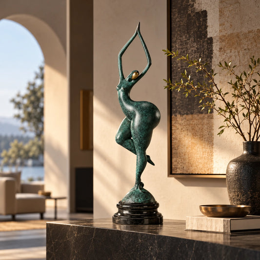 Abstract gymnast bronze sculpture with raised arms and one-leg balance pose displayed in a modern home interior