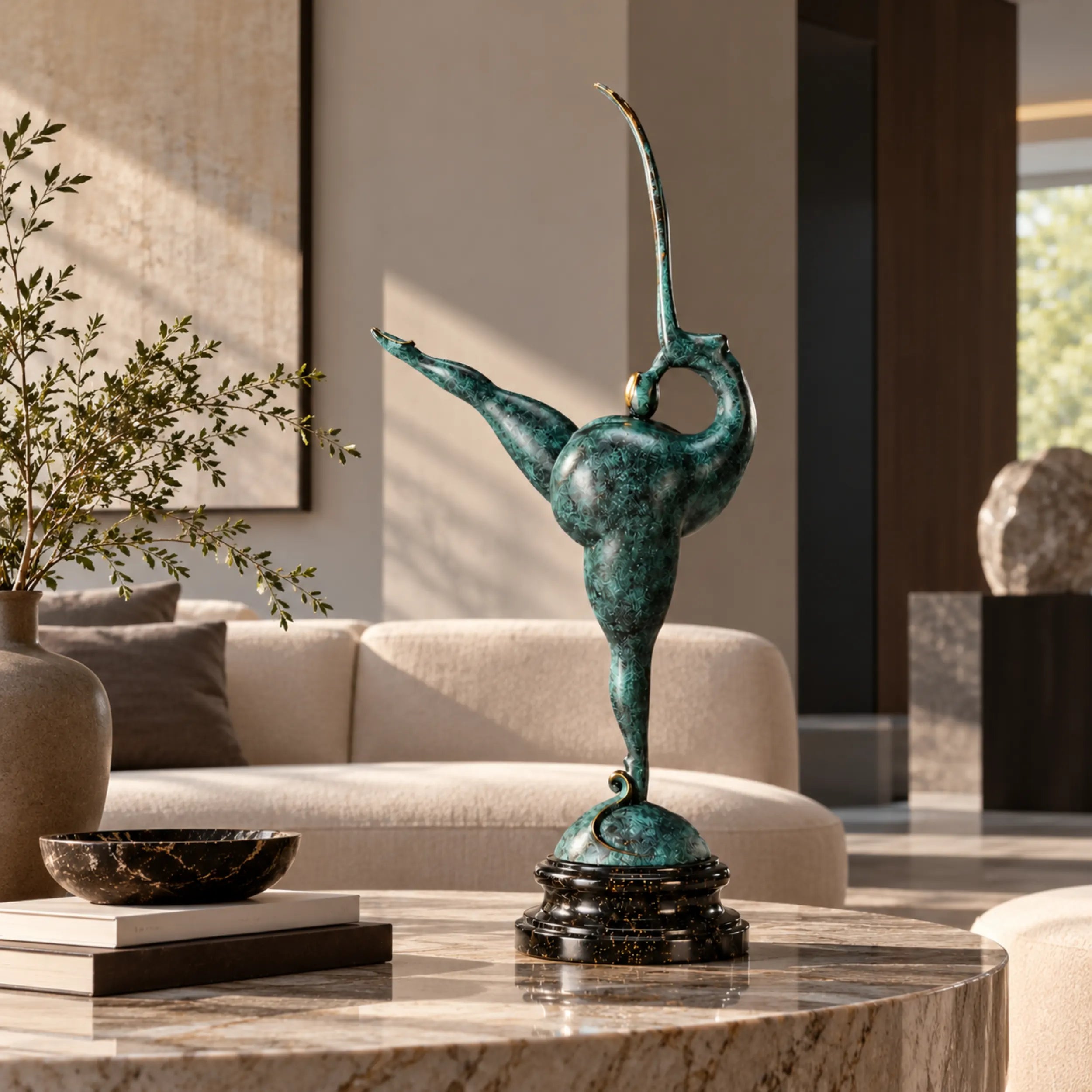 Abstract gymnast bronze sculpture displayed on a marble coffee table in a modern living room