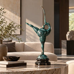 Abstract gymnast bronze sculpture displayed on a marble coffee table in a modern living room