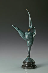 Side profile of abstract gymnast statue with elongated raised arms
