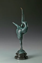Three-quarter view of female gymnast bronze sculpture showing its extended leg