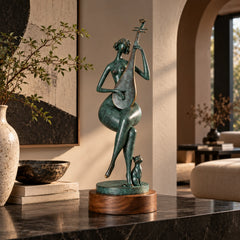 Abstract pipa player bronze sculpture with a cat displayed in a living room