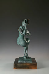 Narrow side view of the bronze female figure with bent legs, raised book, and wooden base