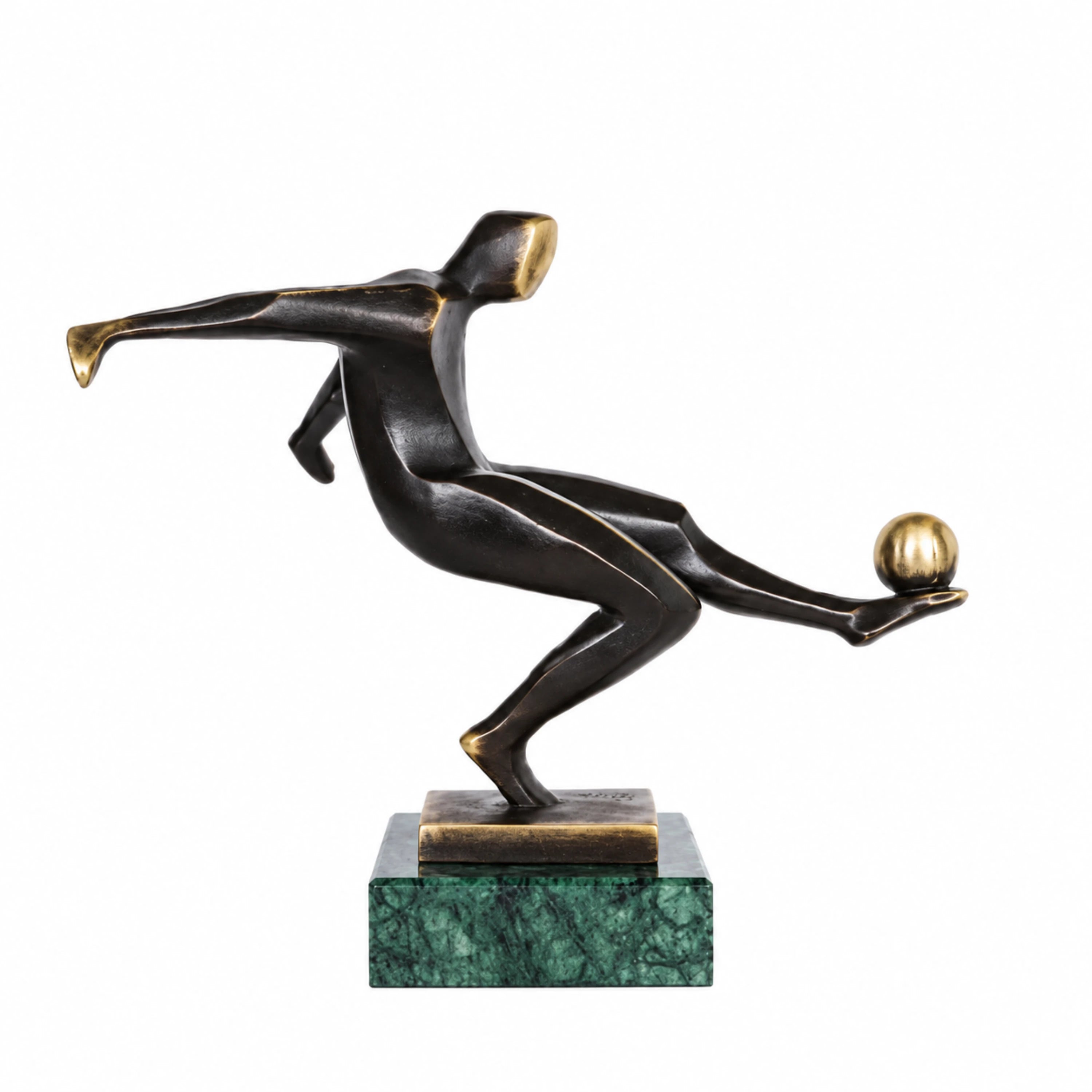 Handcrafted abstract bronze soccer player sculpture kicking a golden ball in a dynamic athletic pose