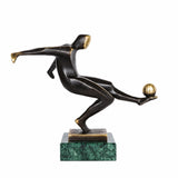 Handcrafted abstract bronze soccer player sculpture kicking a golden ball in a dynamic athletic pose