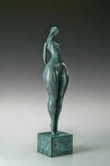 Opposite side view of green patina bronze female figure standing on a square base