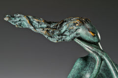 Close-up of the abstract woman's windswept hair and face with textured green bronze patina