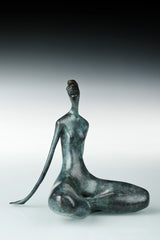 Rear three-quarter view of abstract female yoga sculpture with green patina