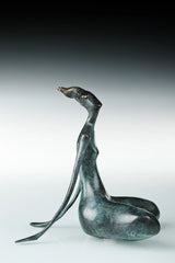 Side profile of seated yoga woman bronze sculpture with a long neck