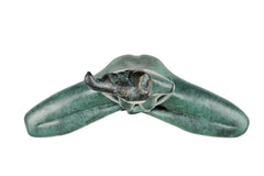 Overhead view of abstract seated yoga woman sculpture showing its folded-leg form