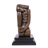Art Deco seated female bronze sculpture with geometric design and olive branch detail