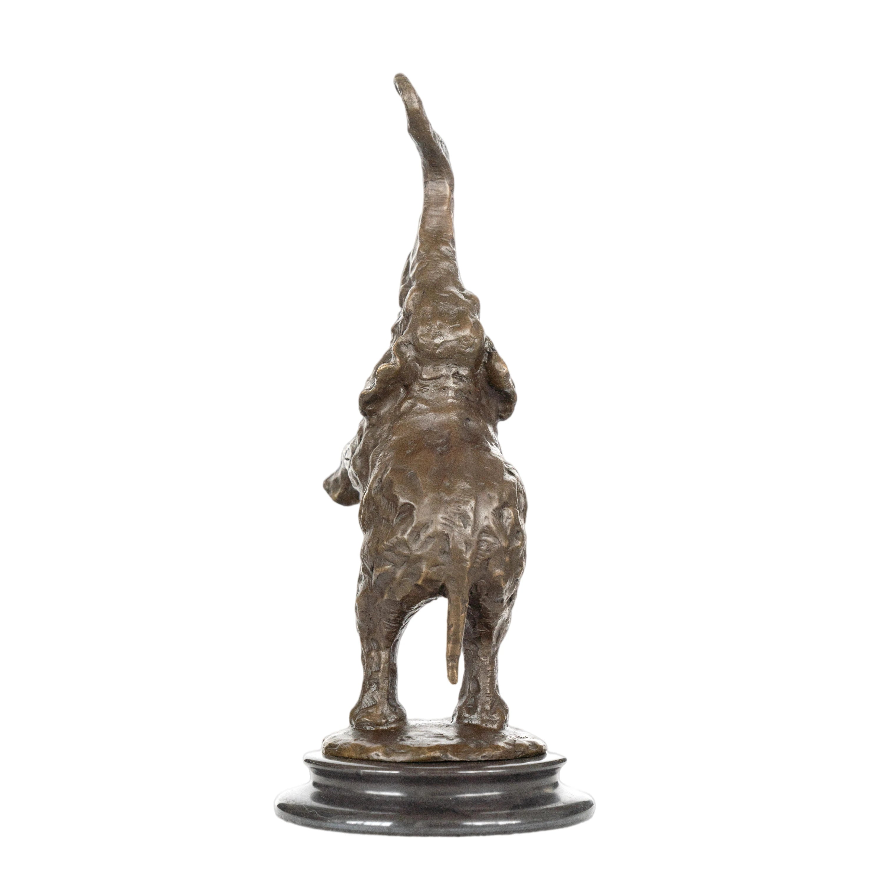 a highly expressive, abstract bronze sculpture of an elephant calf, crafted using the lost-wax casting method. The piece captures the young elephant in a playful, rearing pose—one front leg lifted, trunk curled high into the air, and head tilted upward—conveying a sense of unbridled joy, vitality, and whimsy.