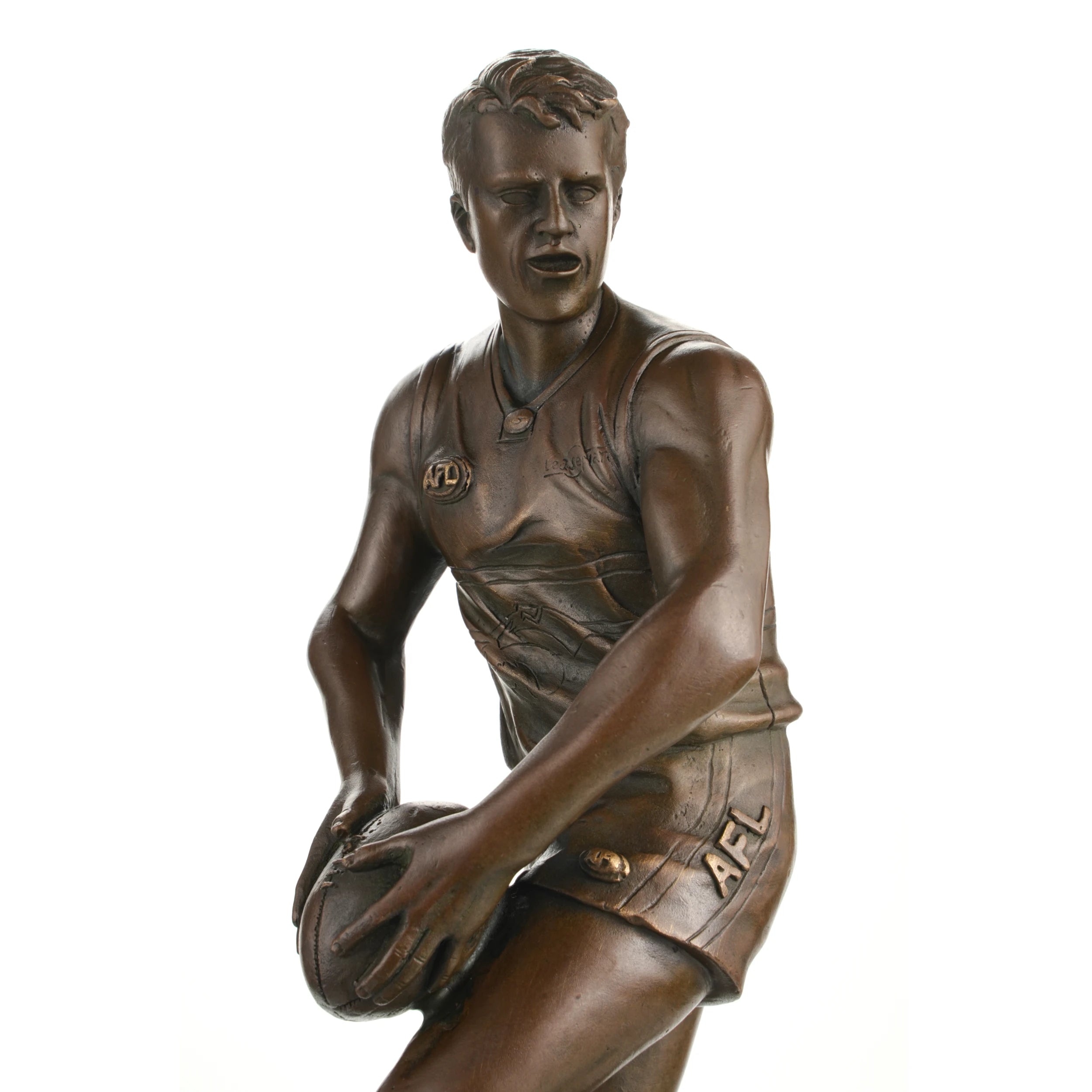 Bronze AFL player statue in action on marble base