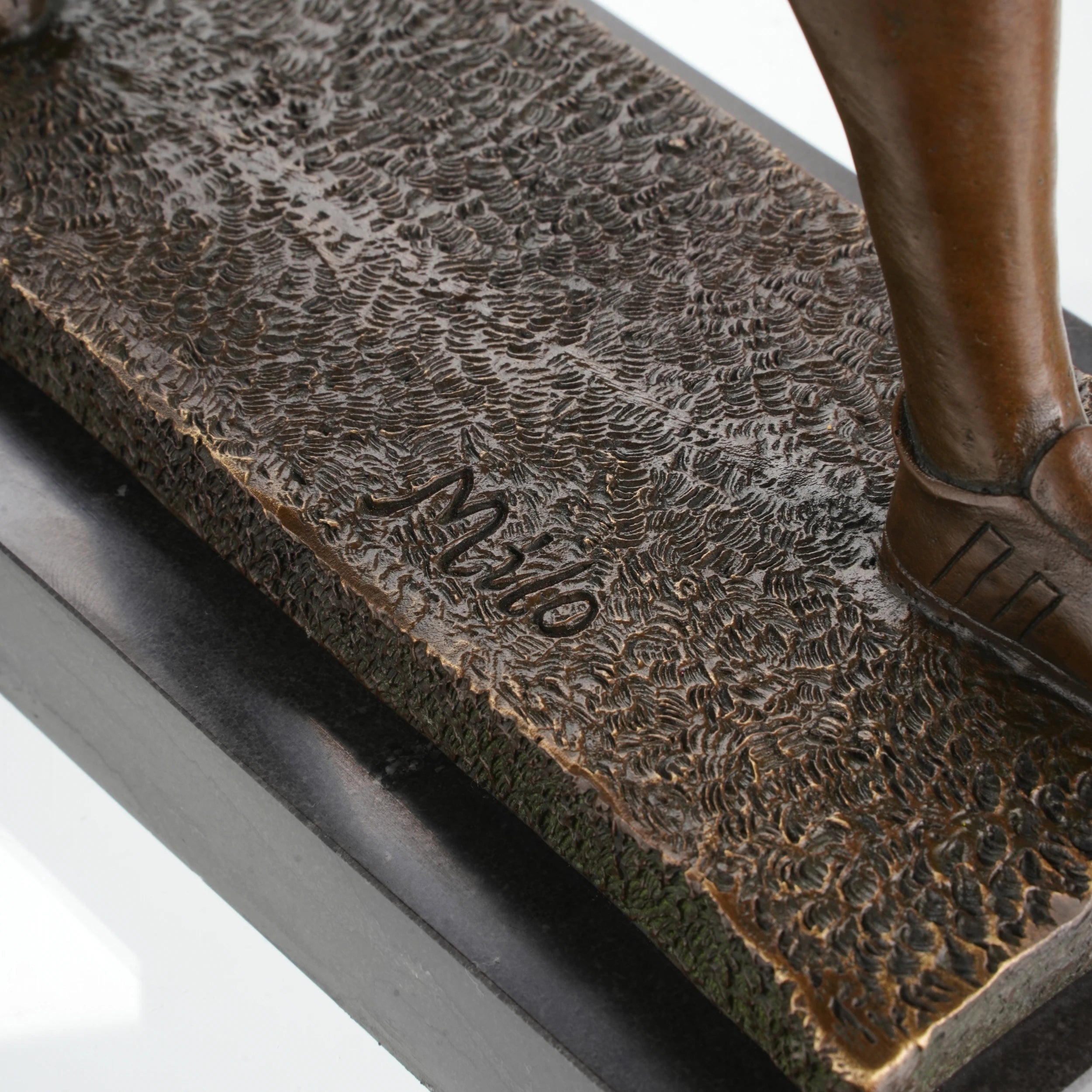 Turf-textured base of AFL statue