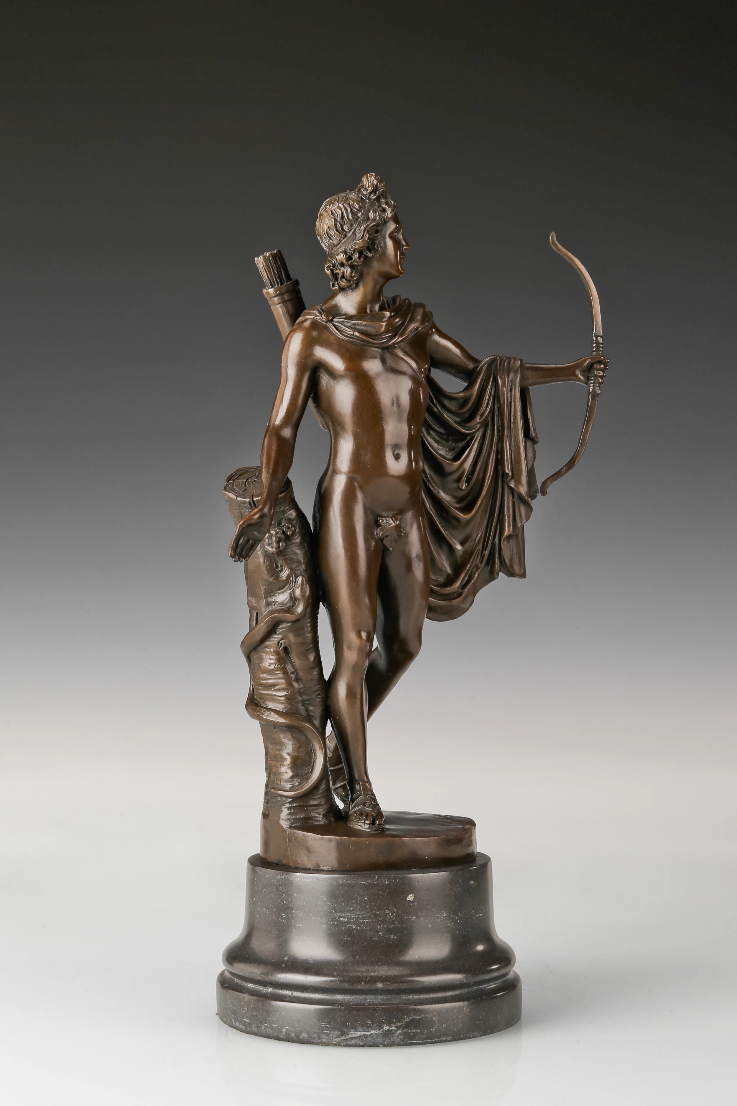 Right side view of classical Apollo statue with bow