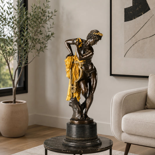 Apollo bronze sculpture displayed in an elegant classical interior