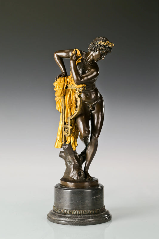 Three quarter view of classical Apollo bronze statue with lyre