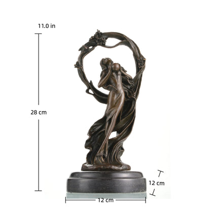 Art Nouveau bronze female sculpture holding an orb, ethereal maiden statue with billowing gown and floral arch on black marble base, loss wax casting fine art.