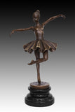 classical balancing ballet dancer bronze statue with raised leg and flowing tutu