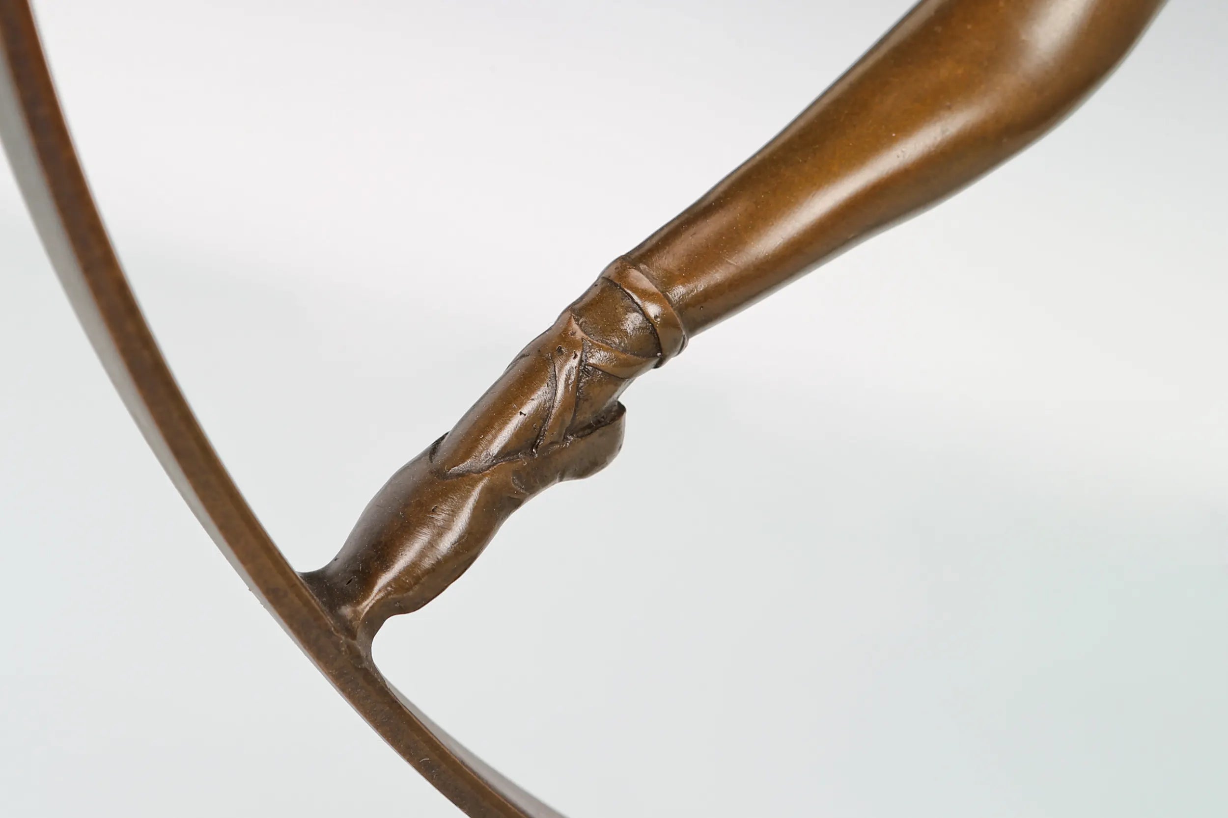 Close-up of the ballerina's extended legs and pointed ballet shoes
