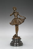 Front view of ballerina holding dress bronze sculpture with a flowing skirt
