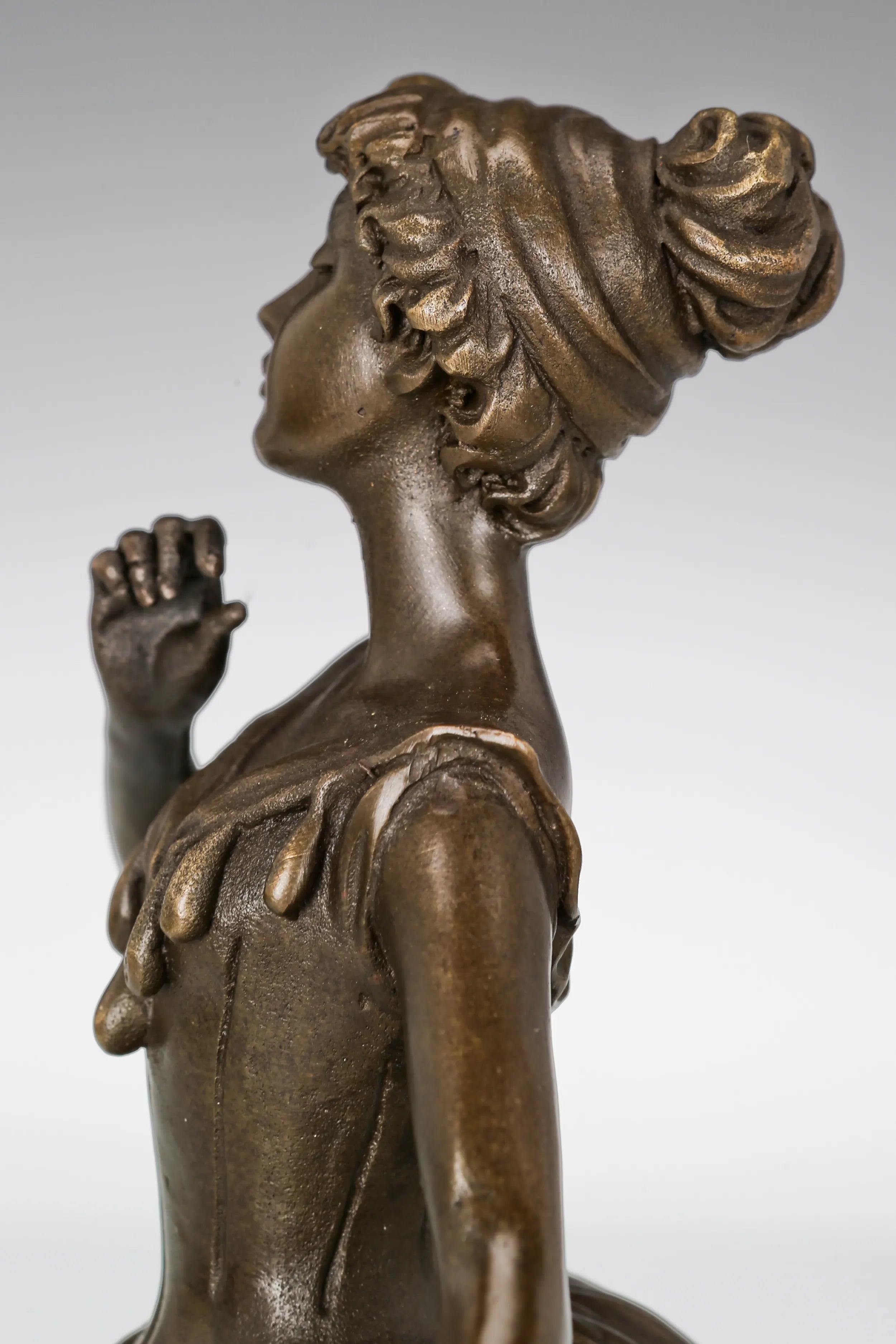 Close-up of ballerina statue holding the edge of her flowing skirt