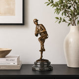 Baseball Pitcher bronze sculpture displayed in a refined interior setting