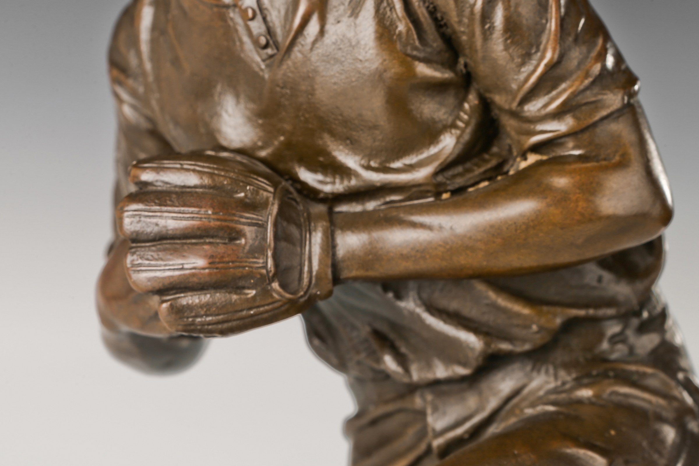 Baseball Pitcher bronze sculpture, clothing and hand detail