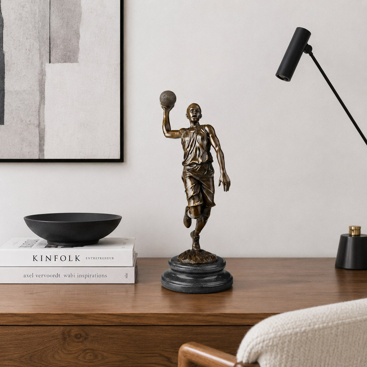 Basketball Player bronze sculpture displayed in a refined interior setting