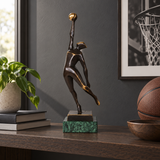 Abstract bronze basketball player statue displayed as modern sports, team, and office decor