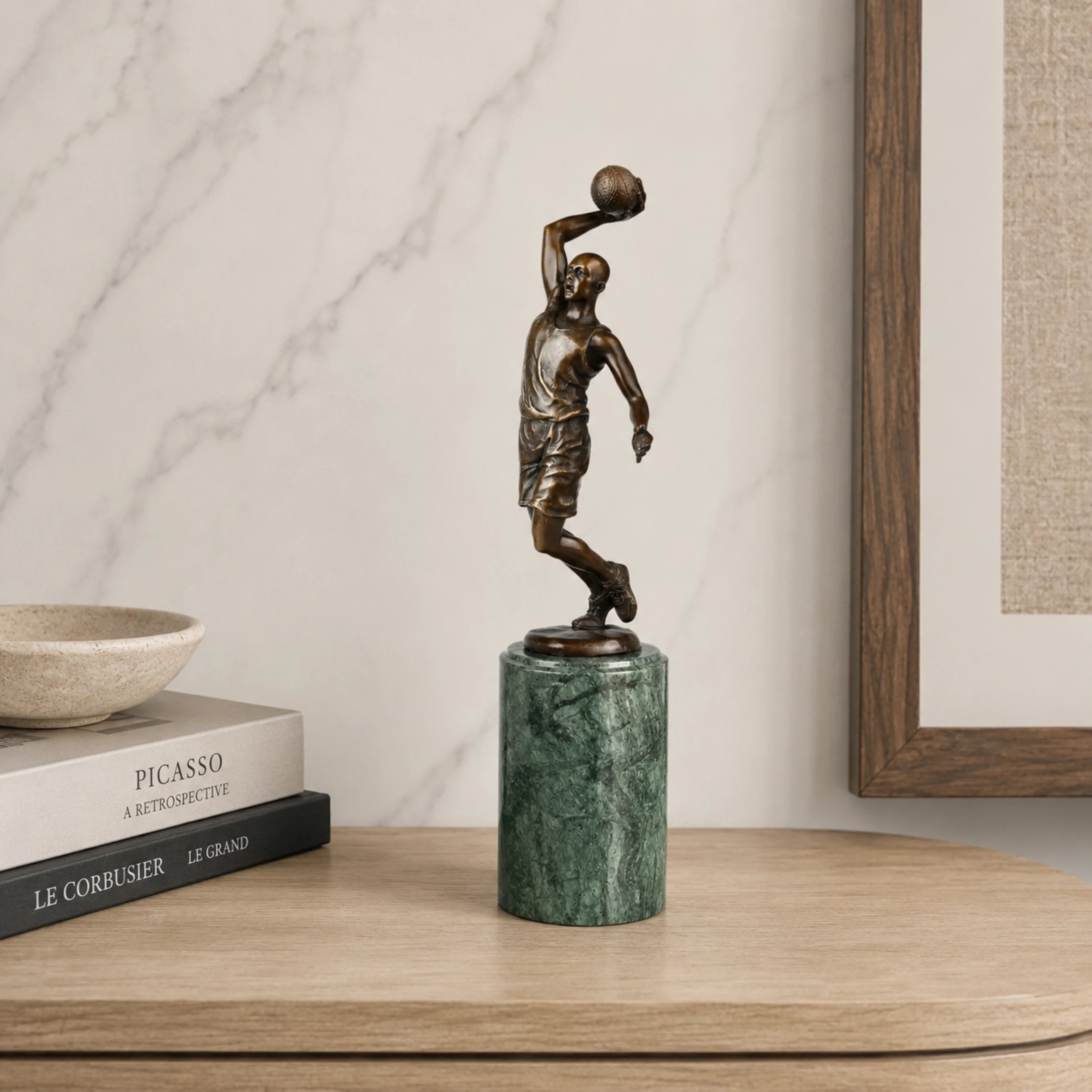 Basketball Shooter Bronze Sculpture displayed in a modern interior