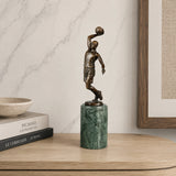 Basketball Shooter Bronze Sculpture displayed in a modern interior