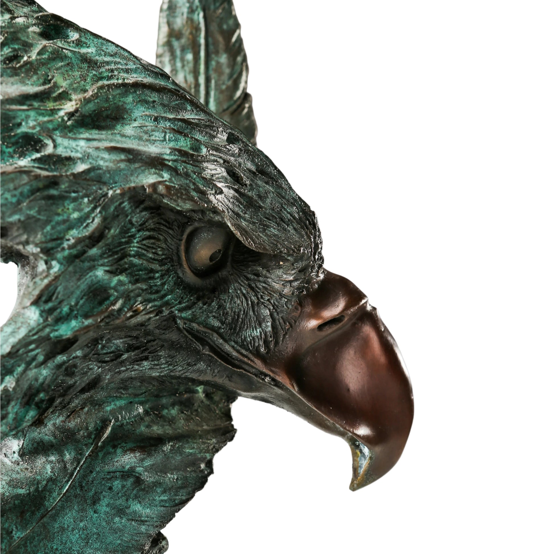 Abstract bronze eagle head sculpture with striking verdigris patina and marble base. A bold wildlife statue symbolizing freedom, strength, and vision.