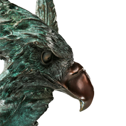 Abstract bronze eagle head sculpture with striking verdigris patina and marble base. A bold wildlife statue symbolizing freedom, strength, and vision.