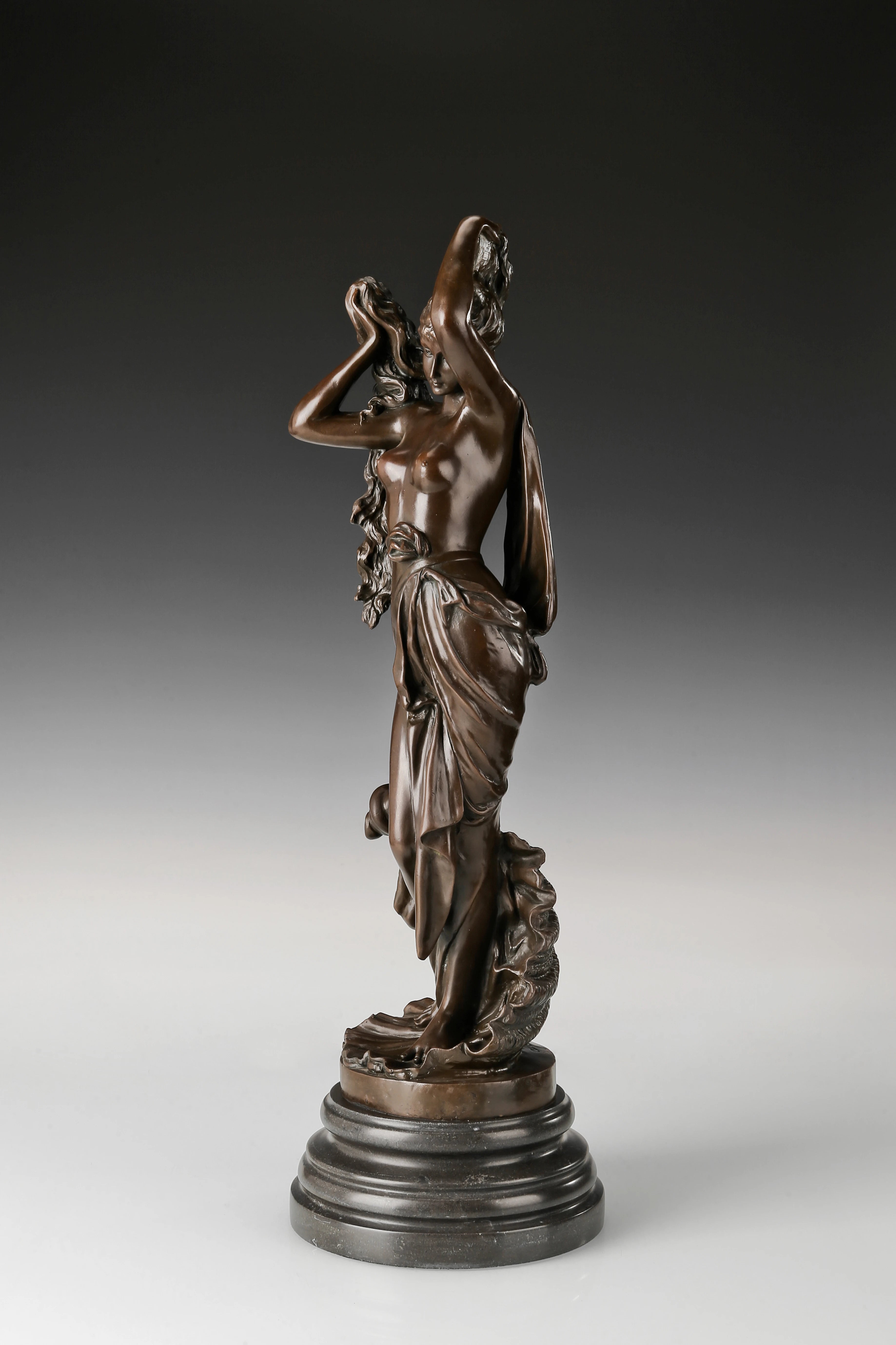 Angled view of Birth of Venus bronze statue showing graceful pose and detailed drapery