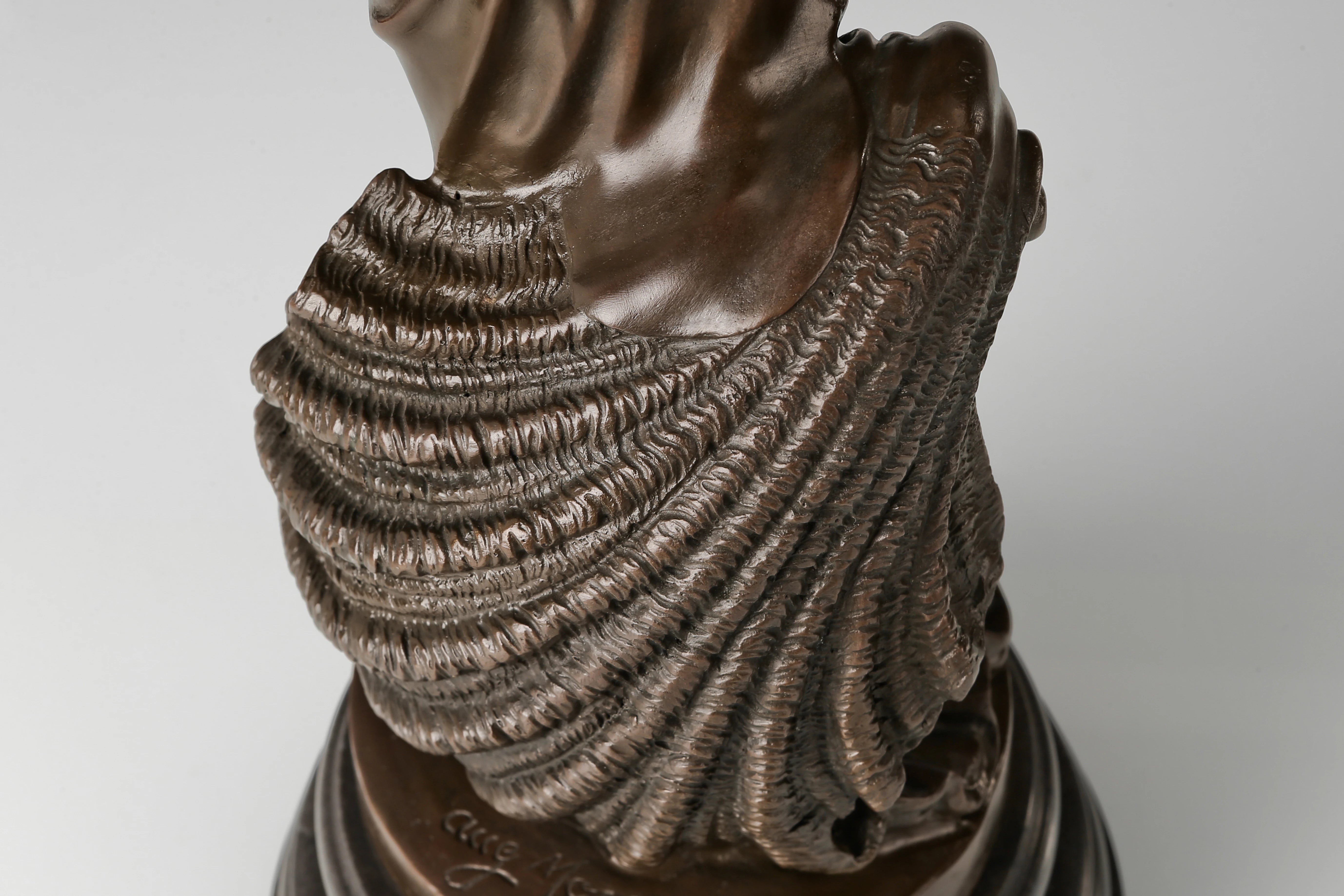 Detail of shell-inspired base and marine elements on the Birth of Venus bronze sculpture