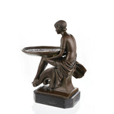 Rear view of a handcrafted bronze lady tray sculpture highlighting flowing drapery and sculptural details.
