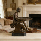 Handcrafted bronze Art Deco lady tray sculpture displayed on a console table in a modern home interior.