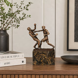 Bronze boxing fighters sculpture displayed as sports decor in a modern gym or boxing club