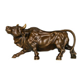Angled view of a handcrafted bronze bull statue symbolizing strength and prosperity.