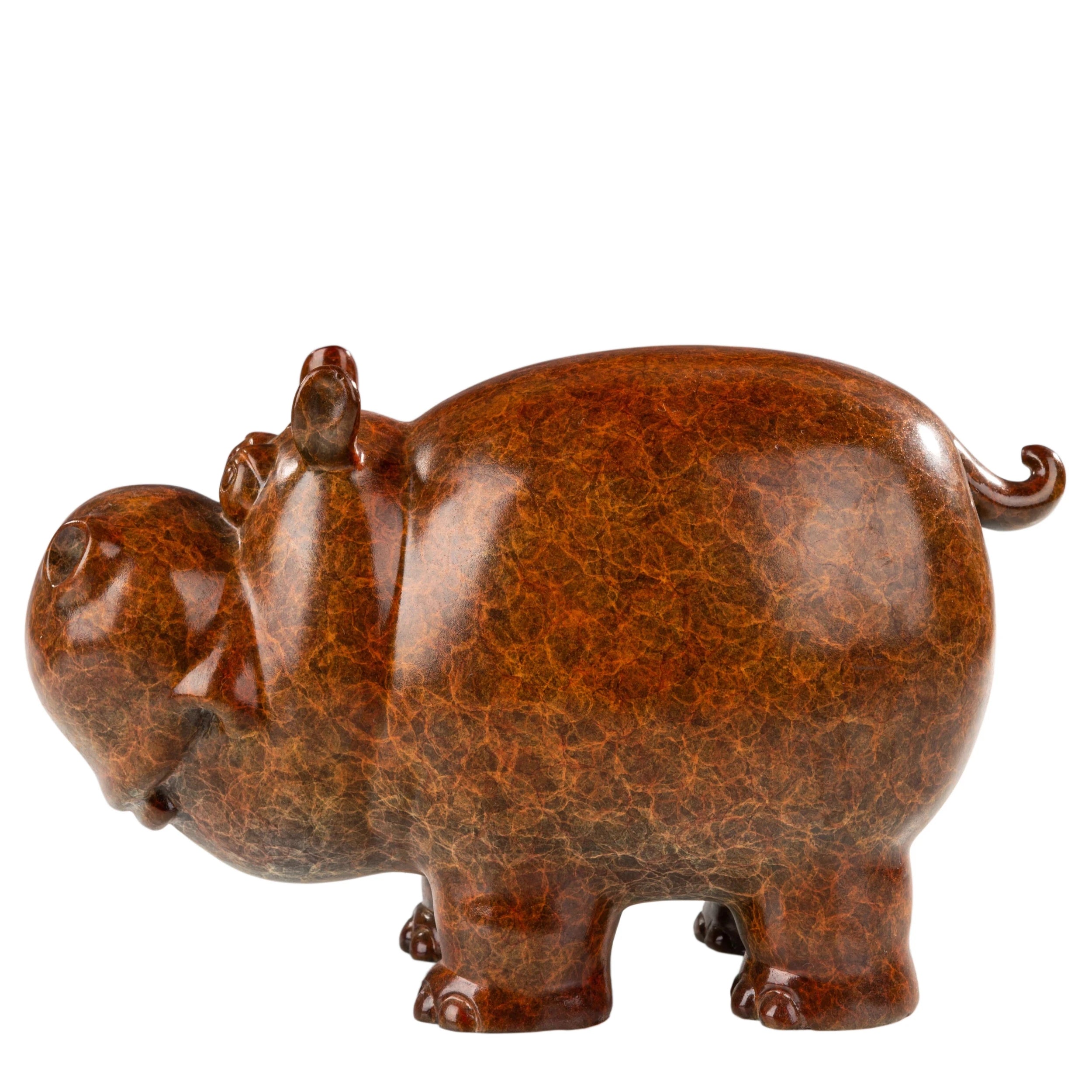 Left side view of handcrafted bronze cow figurine