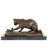 Left side view of bronze cat and butterfly sculpture showing crouching pose and textured fur