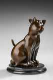 Close-up of bronze cat couple sculpture showing the cats touching faces in a loving gesture