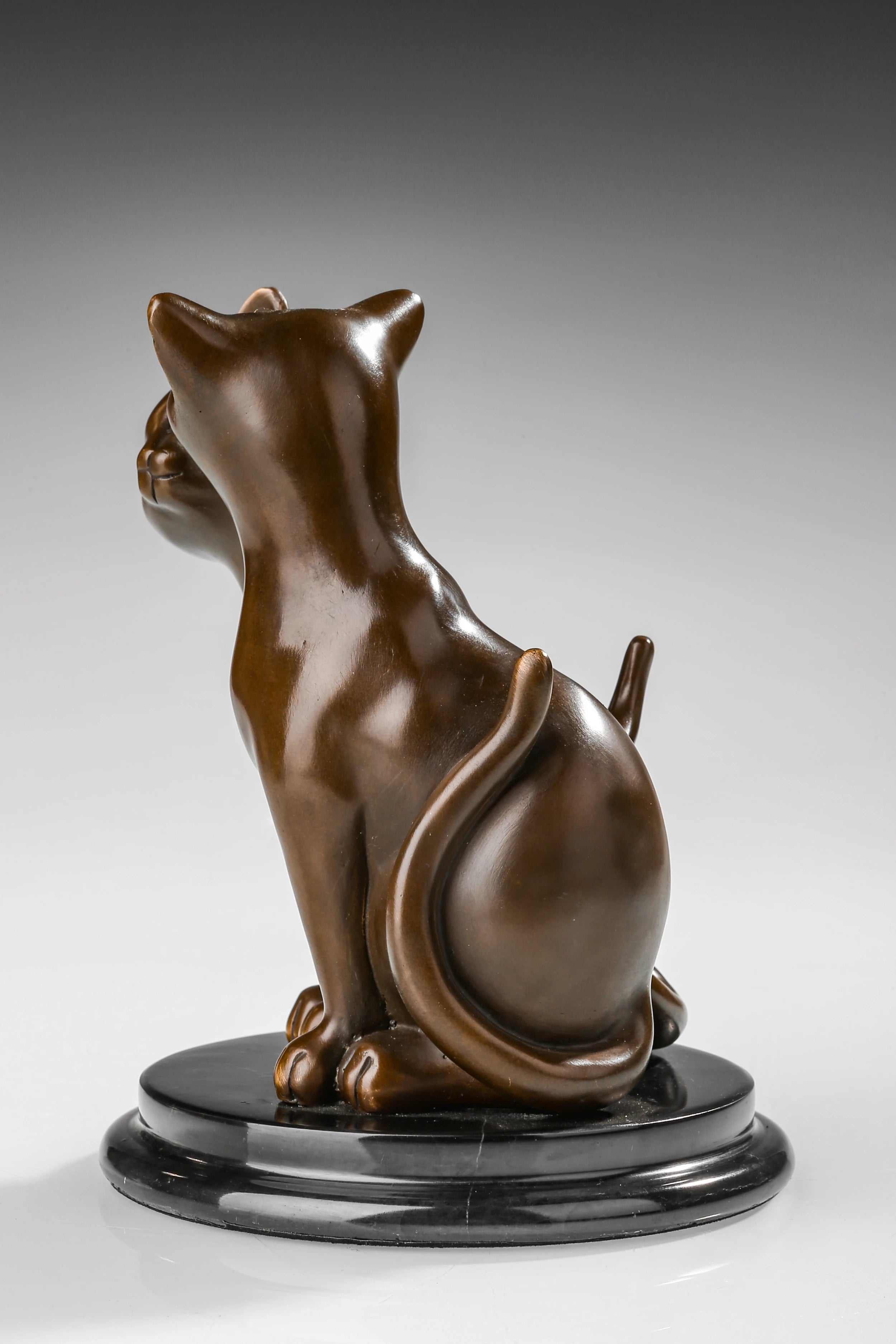 Left side view of bronze cat couple statue with two cats leaning gently toward each other
