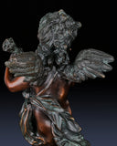 Detailed view of flowing drapery and hand-applied patina on bronze cherub sculpture