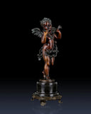 Right side view of classical bronze cherub statue on ornate marble base