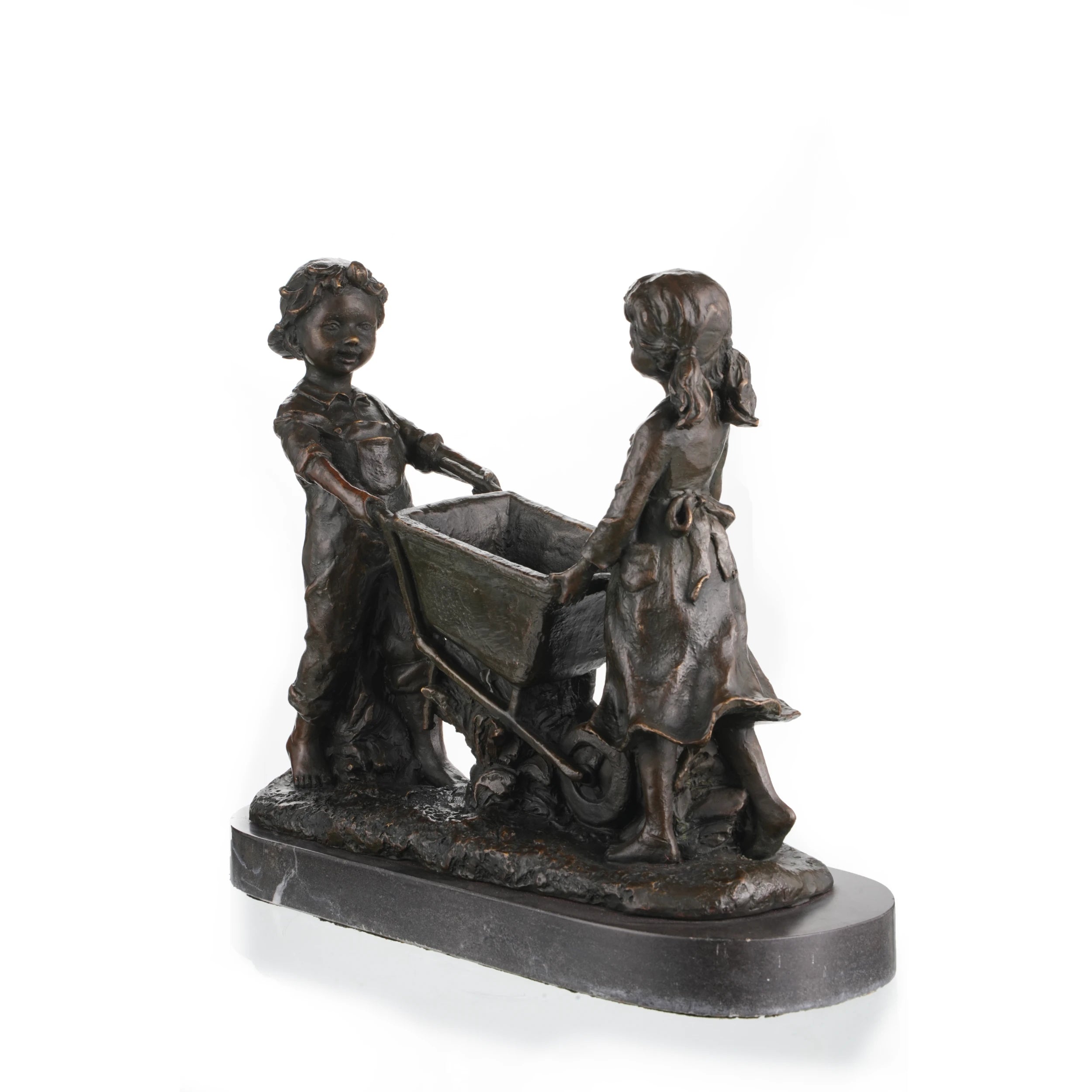 Angled view of bronze children playing sculpture featuring a detailed wheelbarrow.