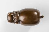 Detailed view of the handcrafted bronze texture and smooth finish of the cute cow sculpture.