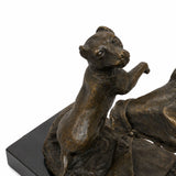 Close-up of small bronze dog interacting with the horse in an animal friendship sculpture