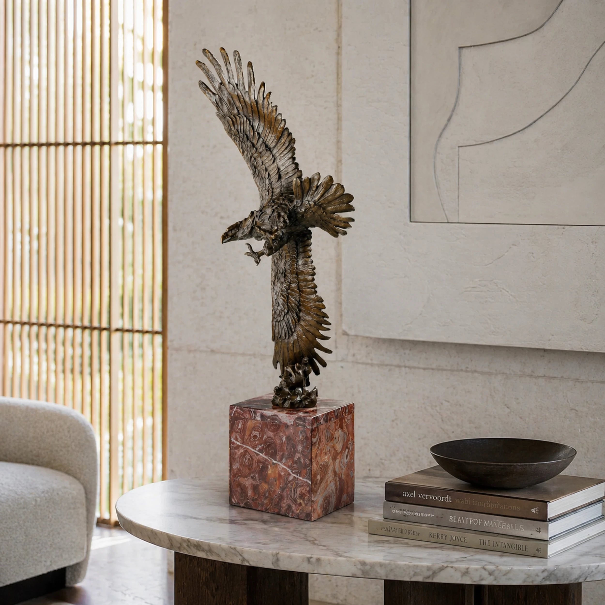 Mythic bronze eagle sculpture diving over waves. A powerful statement piece symbolizing strength, freedom, and mastery of the elements.